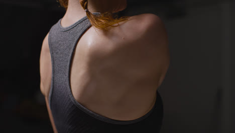 Close-Up-Studio-Shot-Showing-Mature-Woman-Wearing-Gym-Fitness-Clothing-Doing-Stretching-Exercises-3